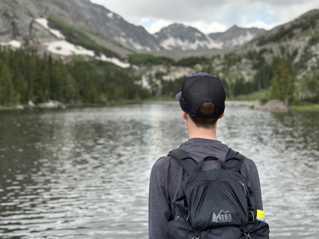 owen at a lake in the mountains.
